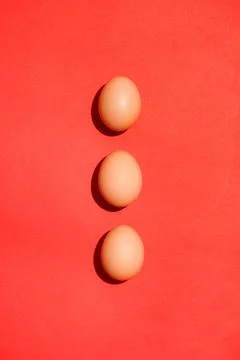Top view of traditional red easter eggs on red background. Stock Photos