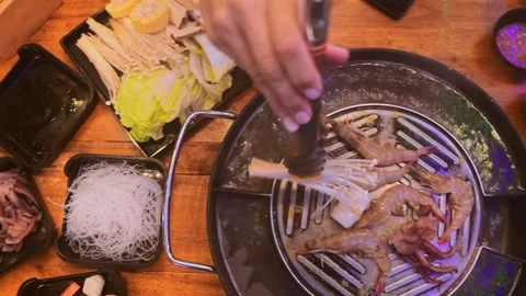 Top view of traditional Thai BBQ hotpot (Moo Krata) with mixed seafood, oct.. Stock-Footage 318632514