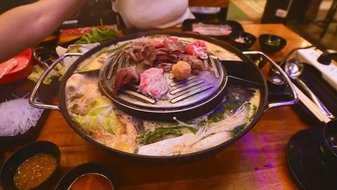 Top view of traditional Thai BBQ hotpot (Moo Krata) with mixed seafood, oct.. Stock Footage 324955901