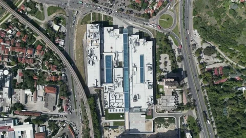 Top view traffic around a big building Stock Footage 214311783