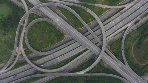 Top view of traffic flow on a large modern urban circular interchange Stock Footage 234182107