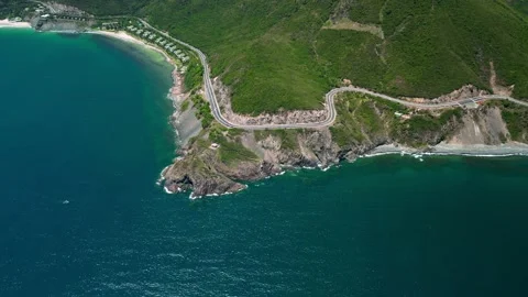 Top view traffic road around the beach. Aerial drone top down view curves of Stock Footage 239953158