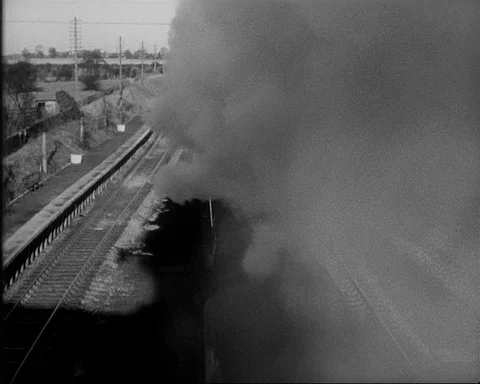 Top view of train passing through station, UK 1957 Video stock 132322183