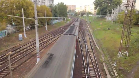 Top view of a train passing under a flyover Video stock 98217112