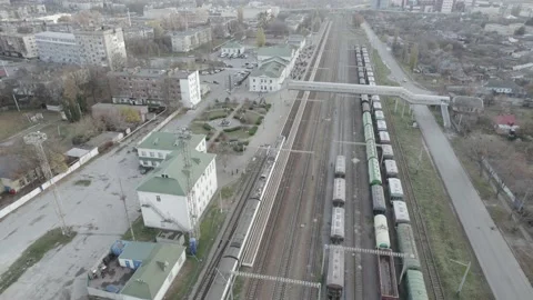 Top view of the trains moving along the railway tracks to the station Stock Footage 219686612
