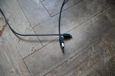 Top view of transfer wire on the floor wood background. Stock Photos