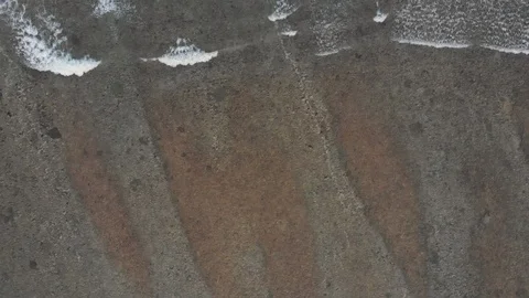 Top view of transition between sandy beach and turquoise sea with waves, Bali Stock Footage 140279177