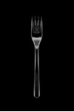 Top view of the transparent plastic fork isolated on black Stock Photos