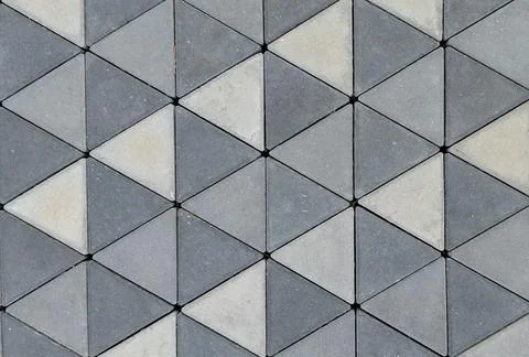 Top view of triangular geometric concrete paver block pattern. Stock Photos