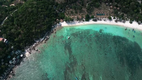 Top view tropical beach with clear turquoise sea water and reefs suitable for Stock Footage 243353871