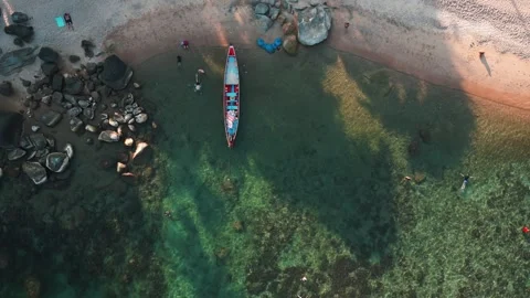 Top view tropical beach with clear turquoise sea water and reefs suitable for Stock Footage 243353896