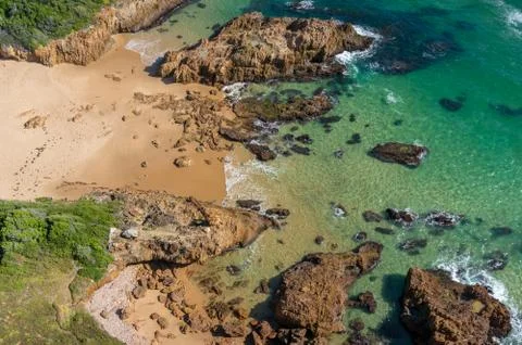 Top view of tropical empty beach with sandy shore and transparent clear water Stock Photos