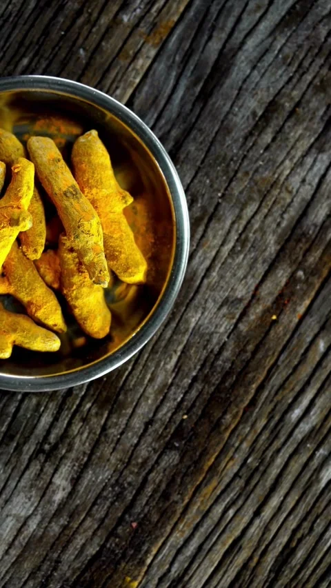 Top View Of Turmeric Arranged On Dark Wood Stock Footage 331762280