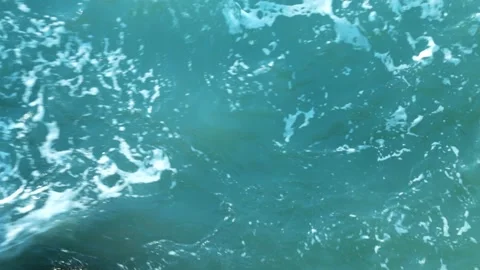 Top view of turquoise Sea surface. The texture of sea water. Transparent Video stock 145977644