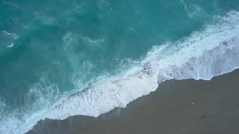 Top view turquoise sea waves foaming and splashing, reaching shore and breaking Stock Footage 109630499