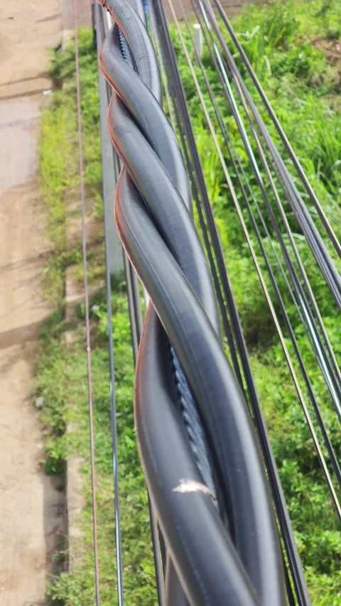 Top view of twisted aerial bundled cable for overhead electrical power. Stock Footage 345129029