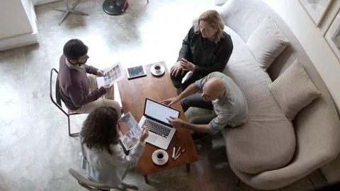 Top view of two architects talking with clients in office Video stock 121003140