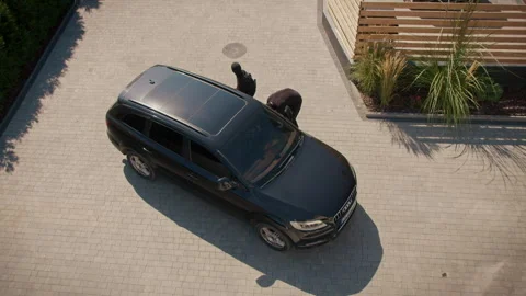 Top View Two Burglars Attempt to Break Into Car but Fail: Car Theft Prevention Video stock 291938977