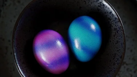 Top view of two colorful Easter eggs on a black plate. Close up 스톡 동영상 116417541
