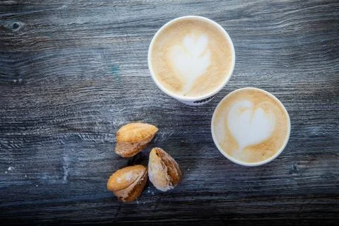 Top view on two cups of coffee and three handmade cookies 写真素材