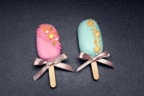 Top view of two decorated cake pops ice creams on black background Stock Photos