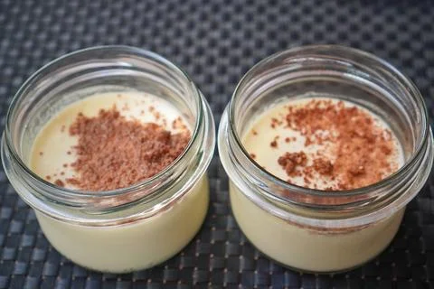 Top view of two dessert jars showing crumb topping and layered filling Stock Photos
