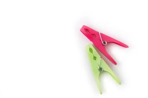Top view of two different color clothespins isolated on white background Foto stock