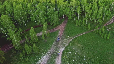 Top view of two enduro motorcycles riding on a mountain road Stock Footage 159158812