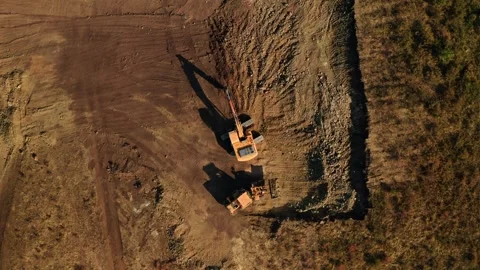 Top view of two excavators doing earthwork at construction site Vídeo Stock 266896445