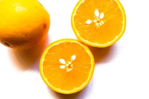 Top view of two halves of orange on white background Stock Photos