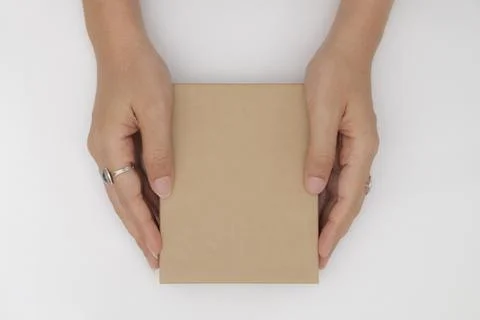 Top view two hands holding and open the empty gift box isolated white backgro Stock Photos