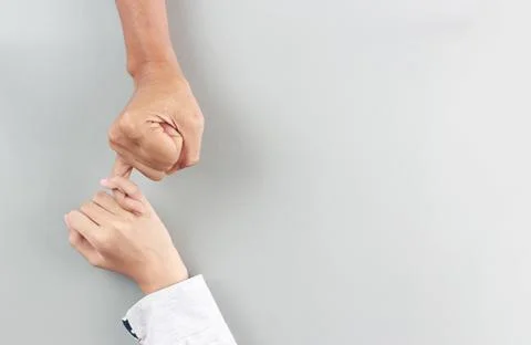 Top view two hands hook each other's little finger concept of promise and  co Stock Photos