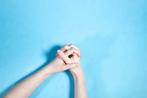 Top view of two hands with interlaced fingers Stock Photos
