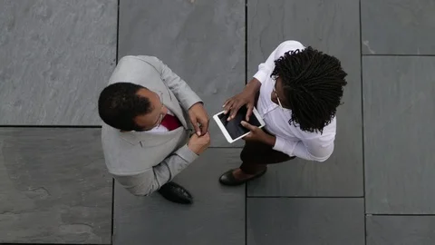 Top view of two managers talking outdoor Stock Footage 114964779