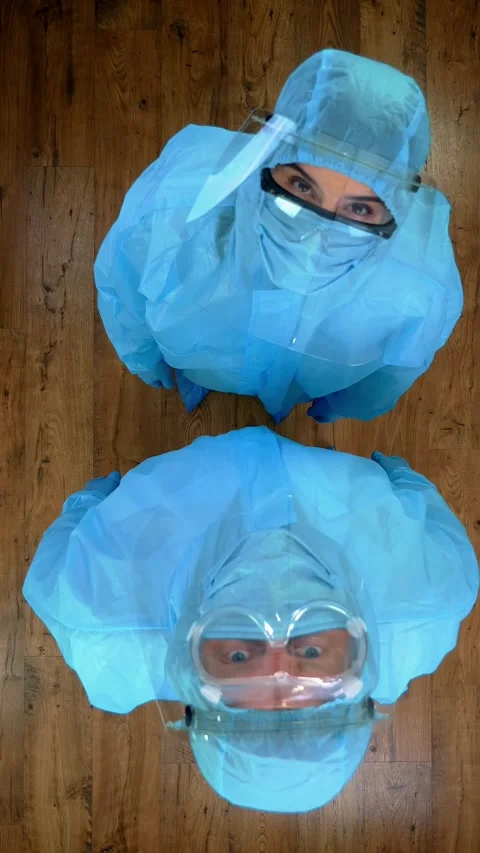 Top view. two medical workers in special protective suits, uniforms, masks, Stock Footage 317440855