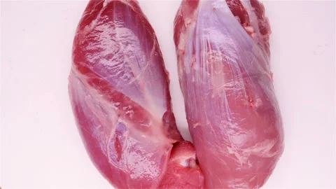 Top view two pieces fresh raw pork rotate and pause Stock Footage 107869894