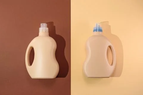 Top view two plastic bottles containers on brown and beige background, mockup Stock Photos