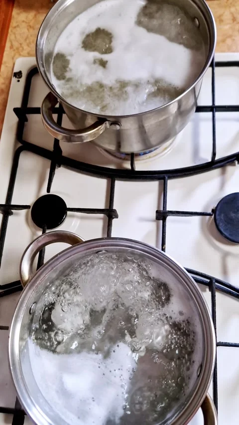 Top View of Two Pots with Boiling Water and Foam Stock Footage 321964366