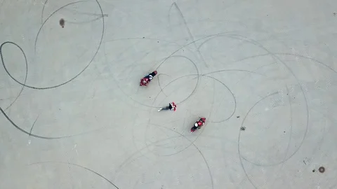 Top view of two professional bikers racing slowly in a circle way.  Stock Footage 111433595