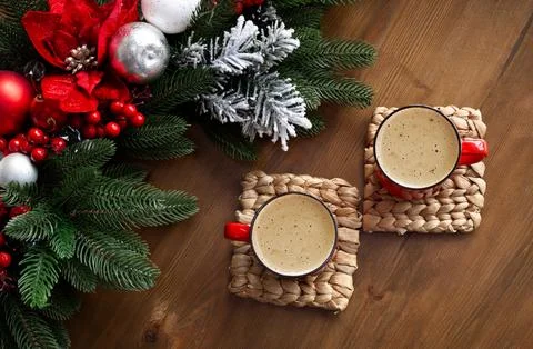Top view of two red mugs with coffee in on wooden table with Christmas Stock Photos