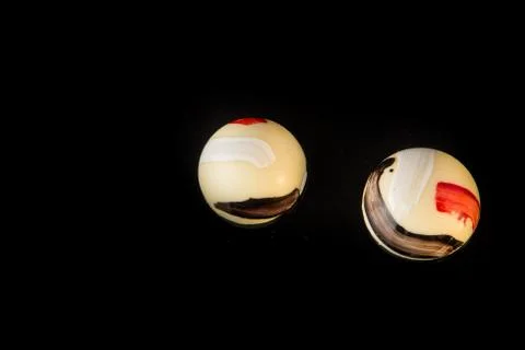 Top view on two round shaped white chocolate candies Stock Photos