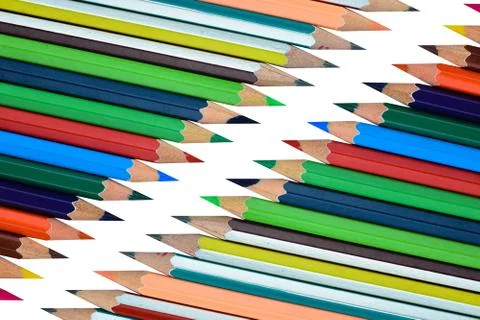 Top view of two rows of different color wood pencil crayons facing each other Stock Photos