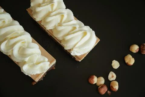 Top View of Two Snickers Style Dessert Cakes with Whipped Cream and Nuts Stock-Fotos