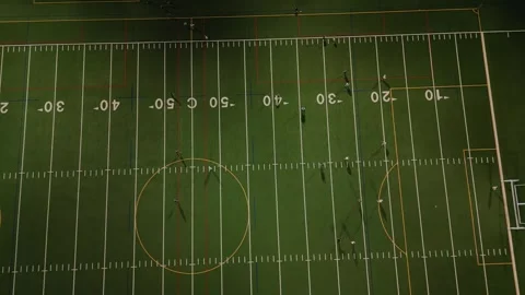 Top view of two teams playing football at night stadium Stock Footage 248145015