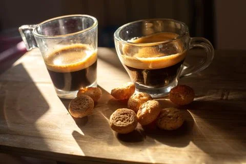 Top view on two transparent cups of italian coffee espresso on wooden surface Stock Photos