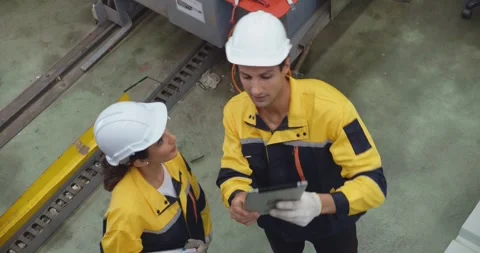 Top view of two warehouse workers holding tablet at distribution while checking. Stock Footage 241901259