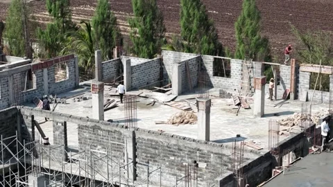 Top View of Unfinished Building Structure with Workers on Construction Site Stock Footage 342260700
