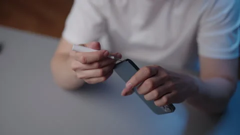 Top view of unrecognizable person using precision tool to clean dust and debris Stock Footage 318518942