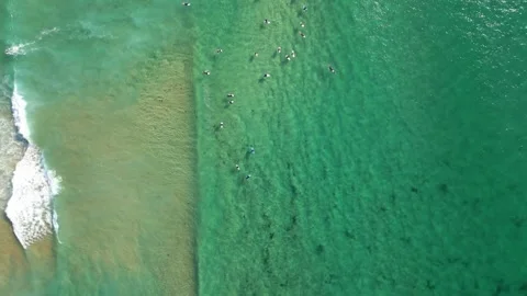 Top view of unrecognizable surfers navigating the clear, turquoise waters of 스톡 동영상 333797512