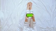 Top View Unrecognizable Woman Using Smartphone With Green Screen Stock Footage